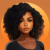 Confident Young Woman Avatar A digital illustration of a confident young Black woman with curly hair and hoop earrings. She has a serene expression and is set against a warm orange background.